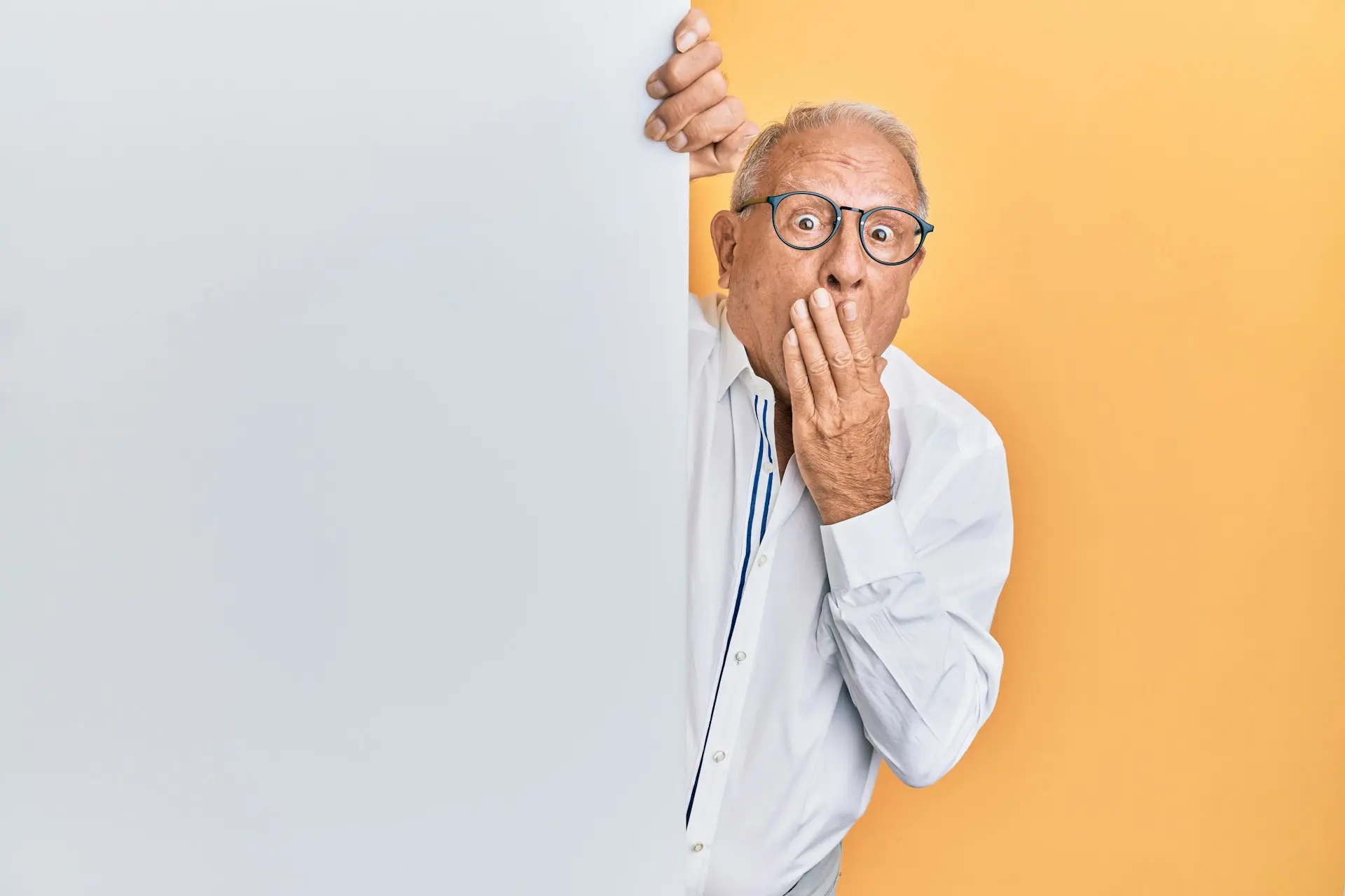 man covering his mouth