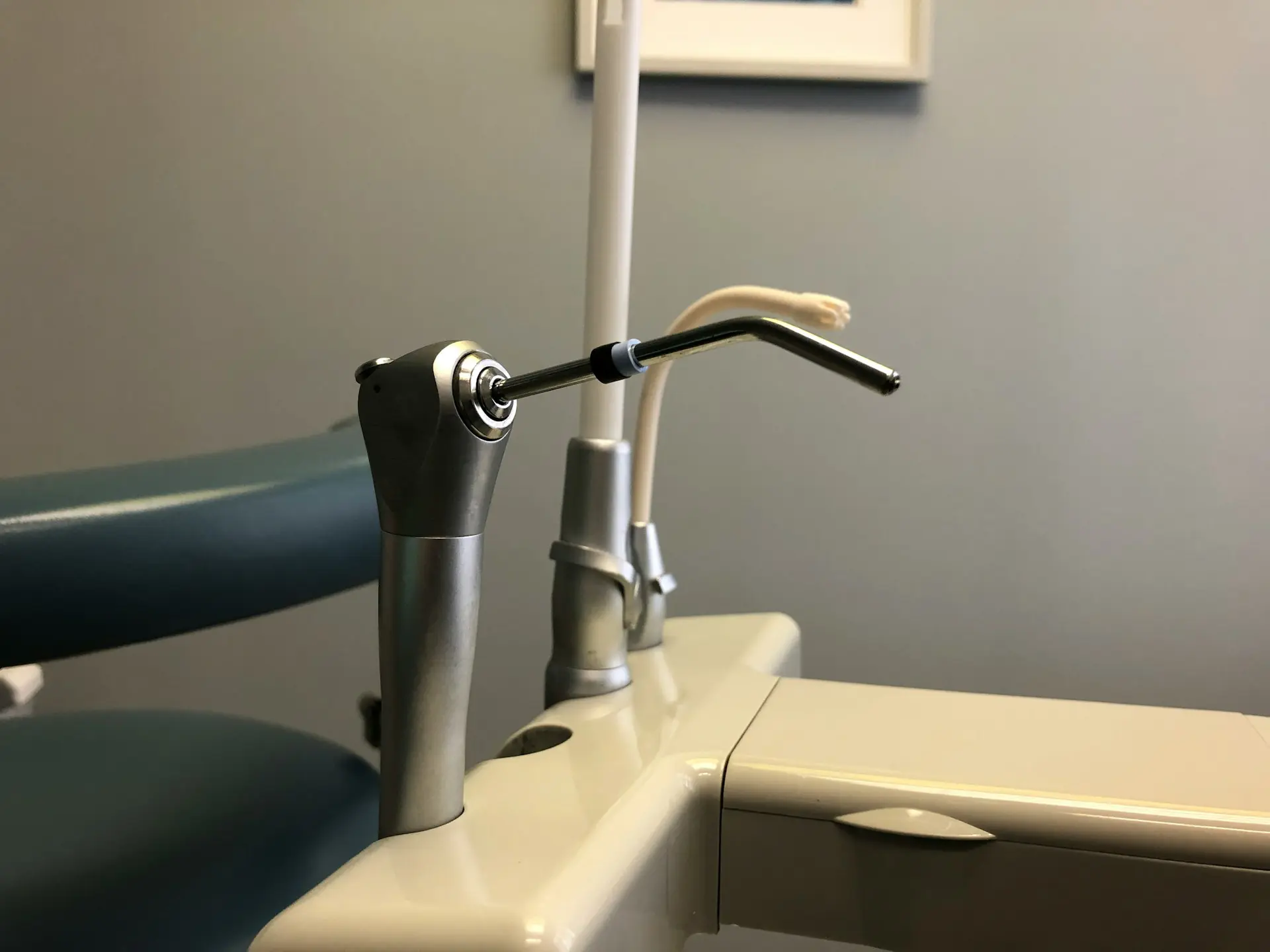 dental tools on a grey backdrop
