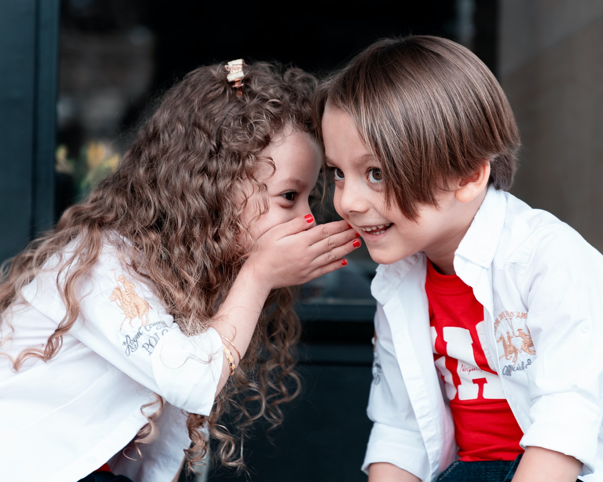 two children talking and smiling - teeth are important