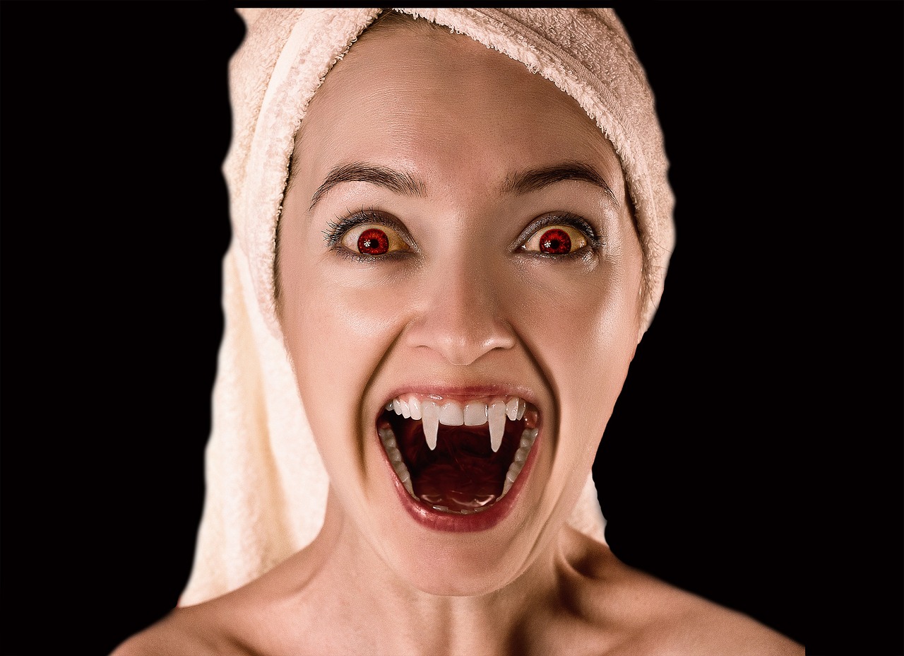 woman dressed as a vampire -dental hygiene tips for Halloween