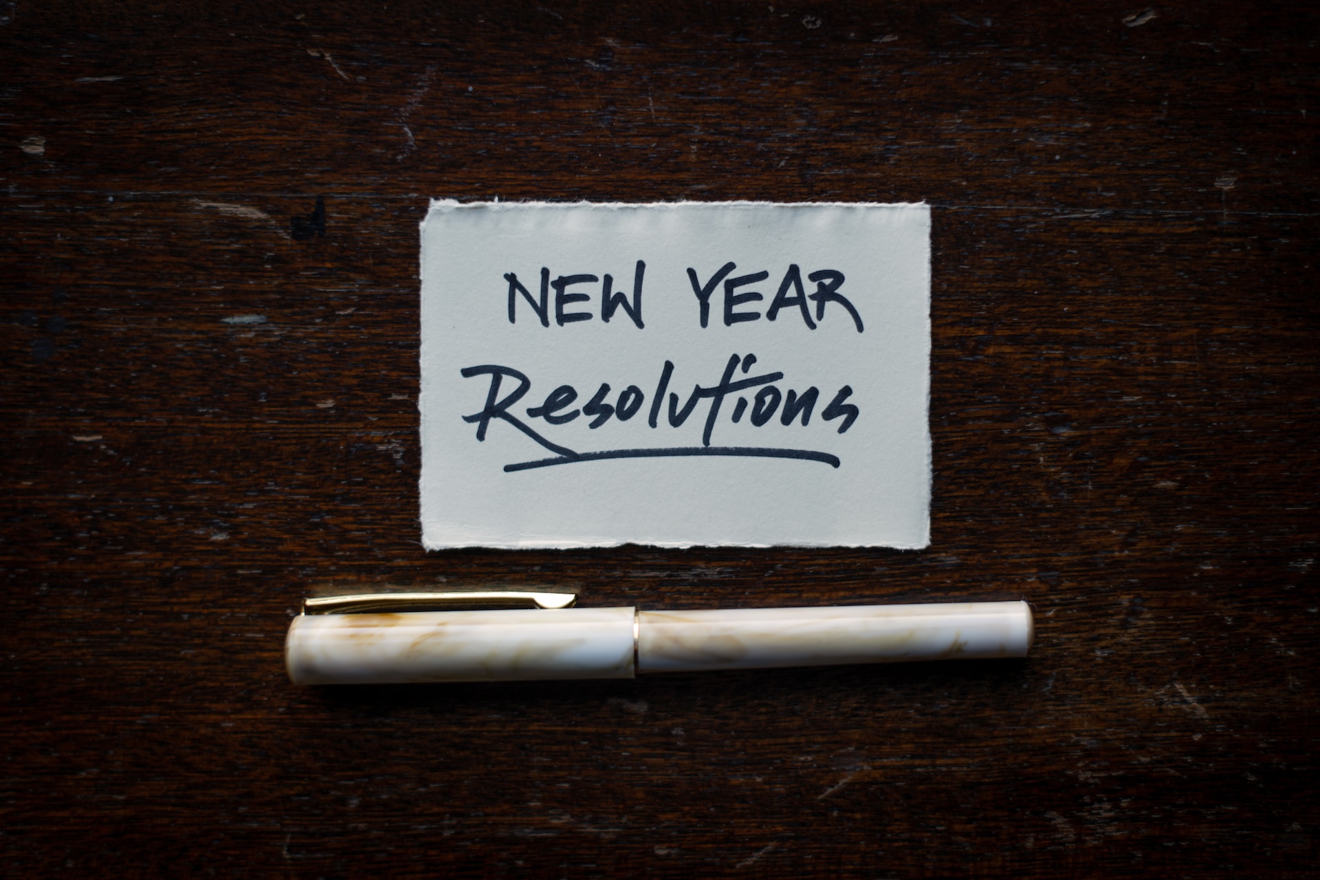 sign that says new years resolutions -dental health new year resolutions